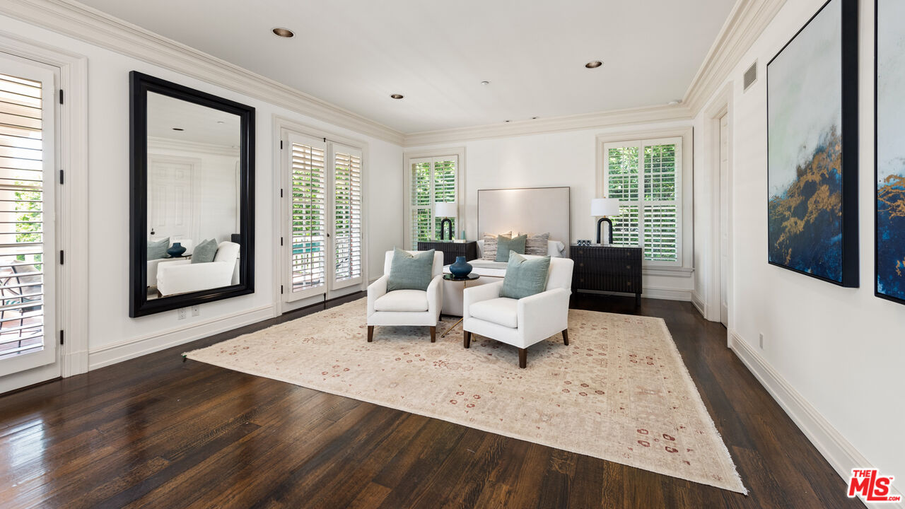 805 North Alpine Drive Beverly Hills, CA 90210 - Photo 37 of 48 a living room with furniture and large windows