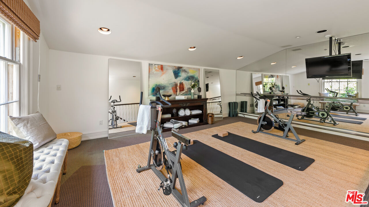 805 North Alpine Drive Beverly Hills, CA 90210 - Photo 40 of 48 a view of a livingroom with furniture and a flat screen tv