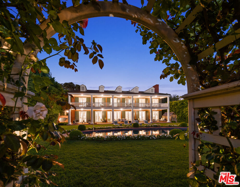 805 North Alpine Drive Beverly Hills, CA 90210 - Photo 4 of 48 a view of a large building with a big yard