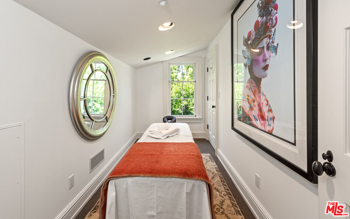 805 North Alpine Drive Beverly Hills, CA 90210 - Photo 41 of 48 a very nice looking room with a large window