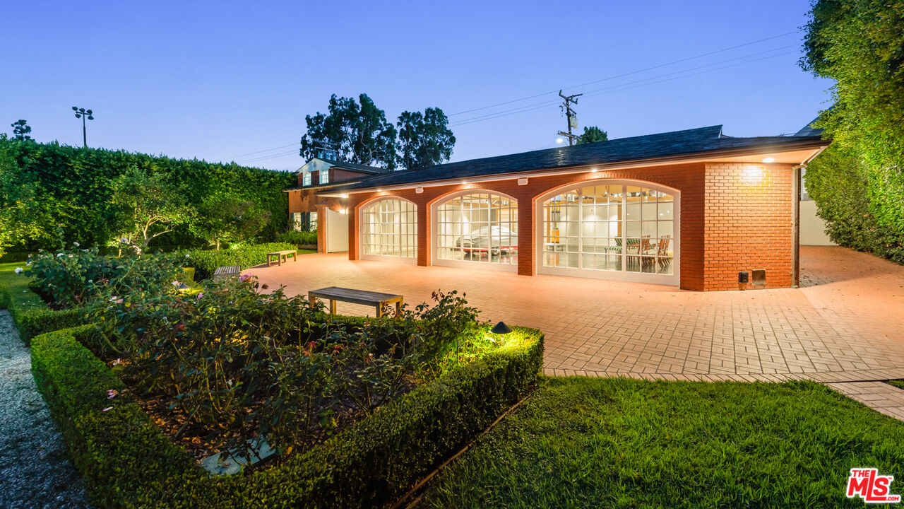 805 North Alpine Drive Beverly Hills, CA 90210 - Photo 42 of 48 a front view of a house with a yard