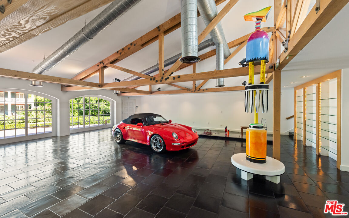 805 North Alpine Drive Beverly Hills, CA 90210 - Photo 43 of 48 a living room with furniture and a floor to ceiling window