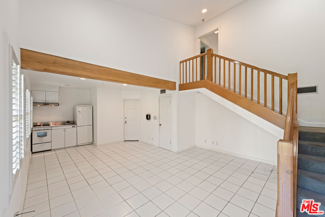 805 North Alpine Drive Beverly Hills, CA 90210 - Photo 45 of 48 a view of a hallway view with staircase