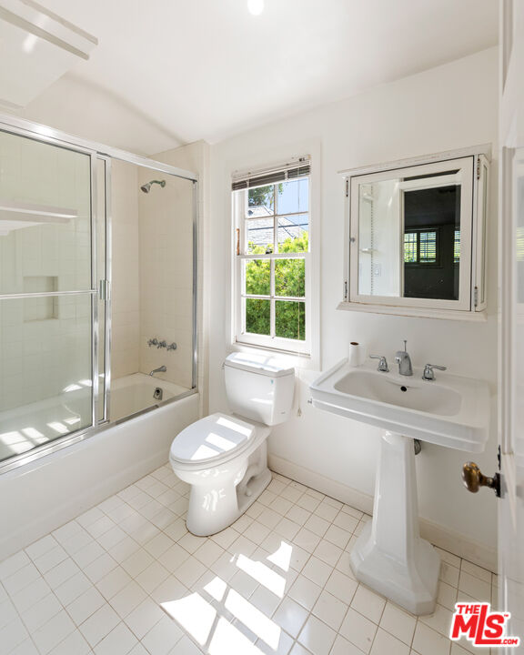 805 North Alpine Drive Beverly Hills, CA 90210 - Photo 46 of 48 a bathroom with a toilet sink and mirror