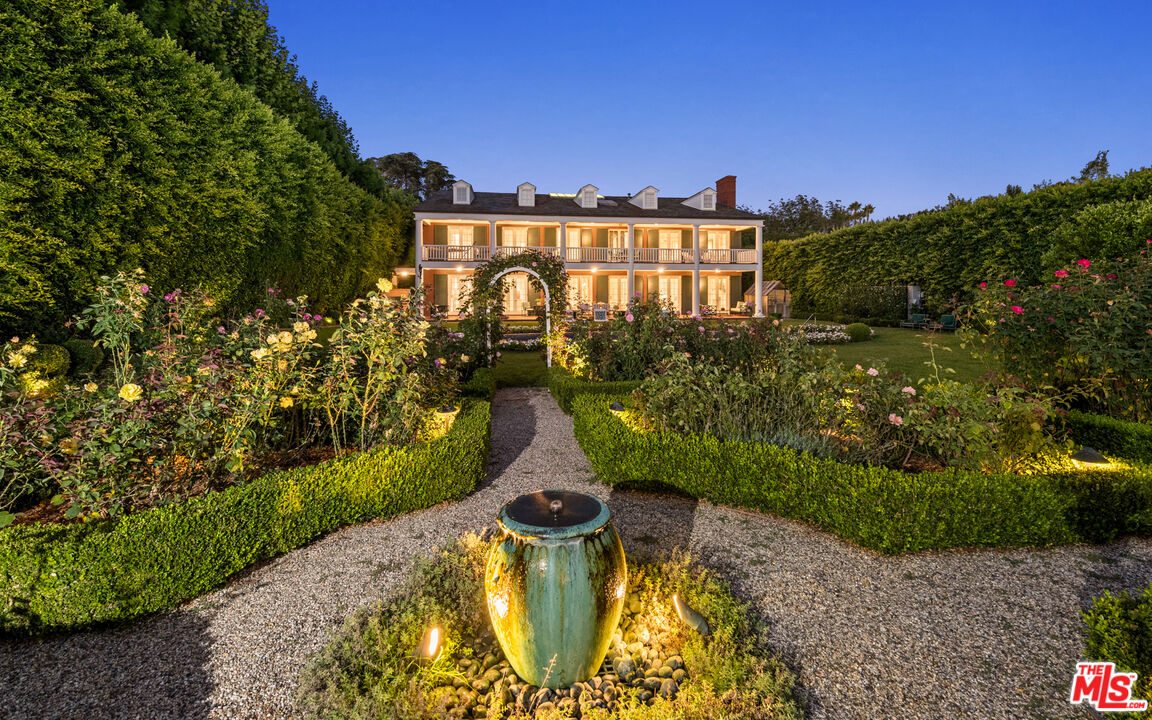 805 North Alpine Drive Beverly Hills, CA 90210 - Photo 47 of 48 a view of a lake with a garden