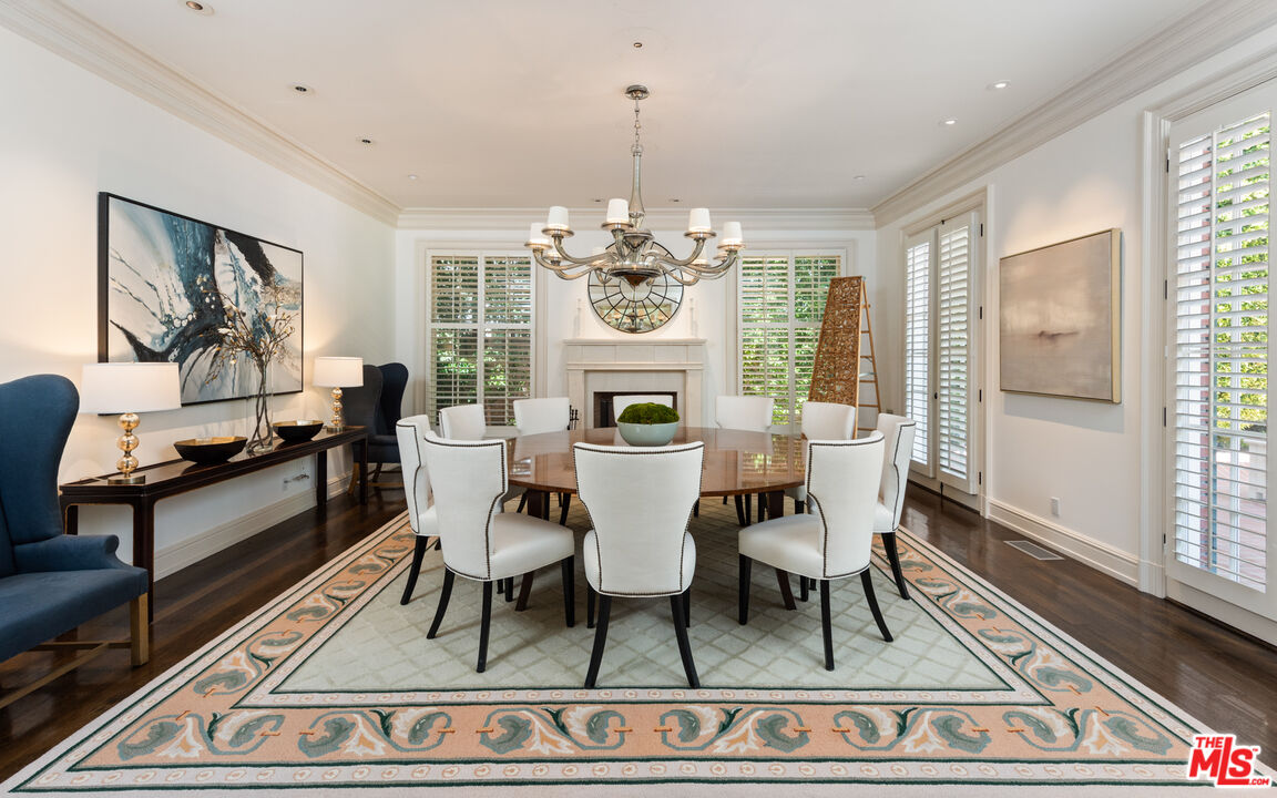 805 North Alpine Drive Beverly Hills, CA 90210 - Photo 9 of 48 a dining room with furniture a rug and wooden floor