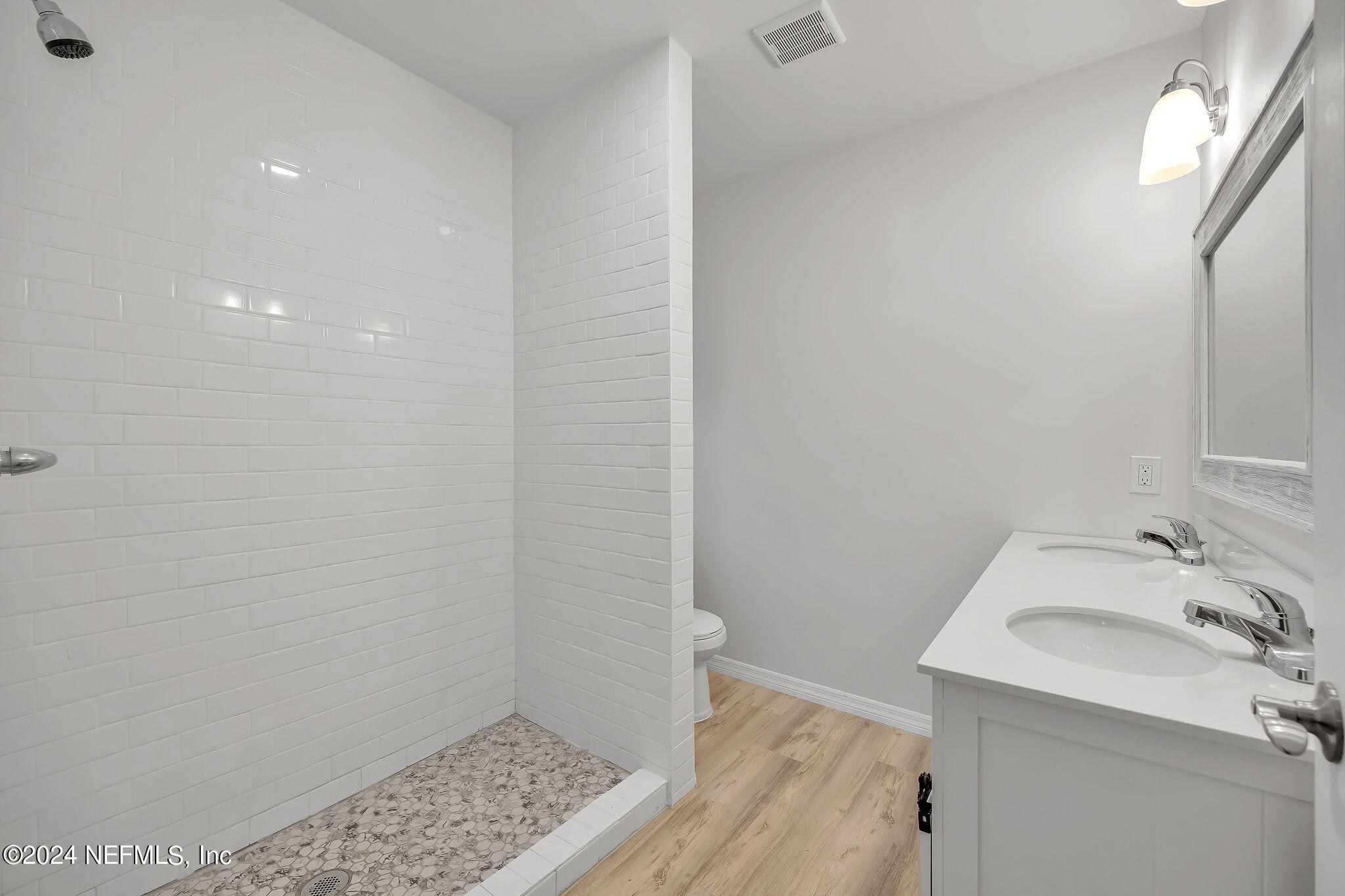 7519 Birdies Road Jacksonville, FL 32256 - Photo 22 of 24 a bathroom with a sink and a mirror