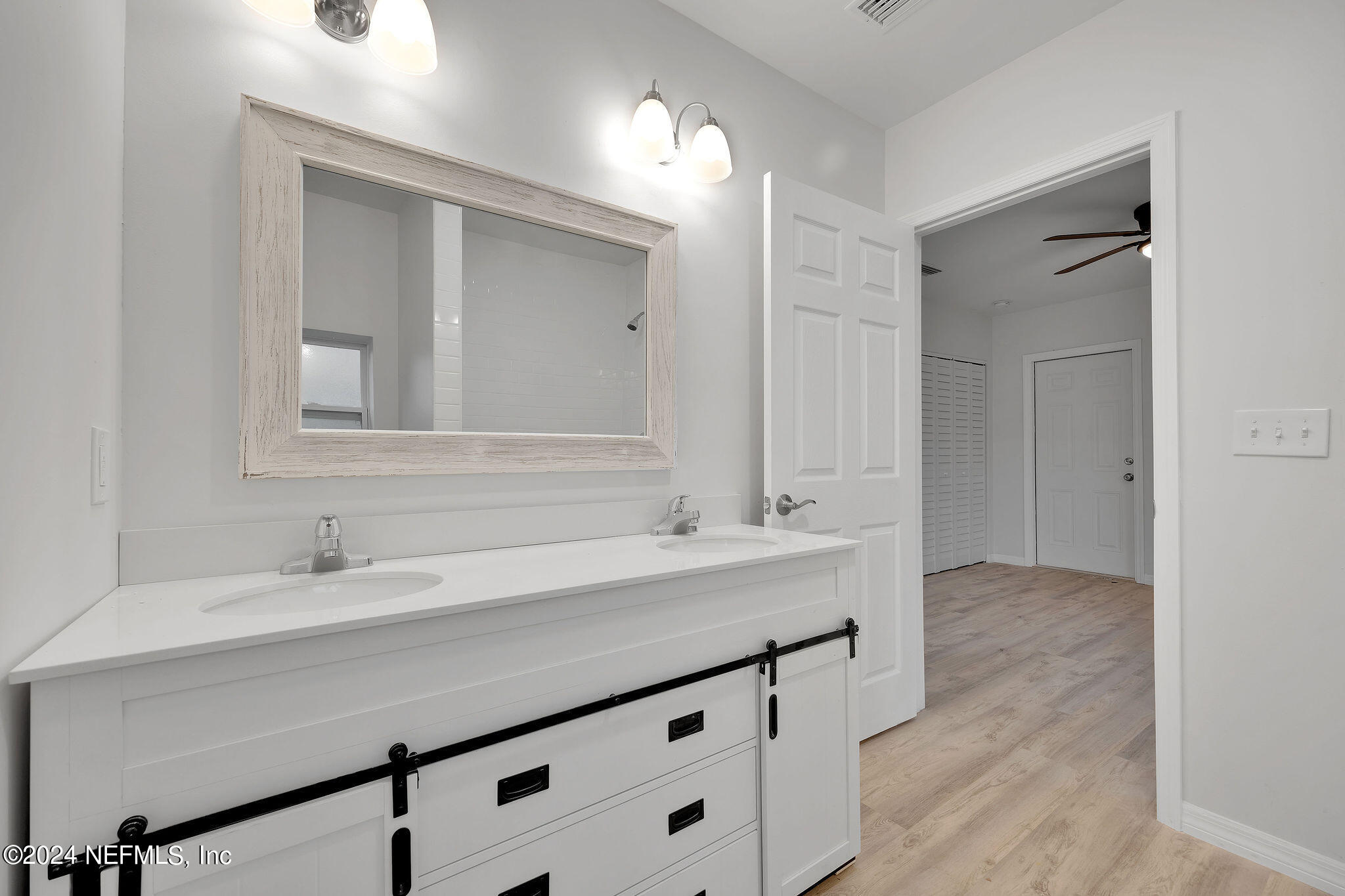 7519 Birdies Road Jacksonville, FL 32256 - Photo 23 of 24 a bathroom with a sink and a mirror