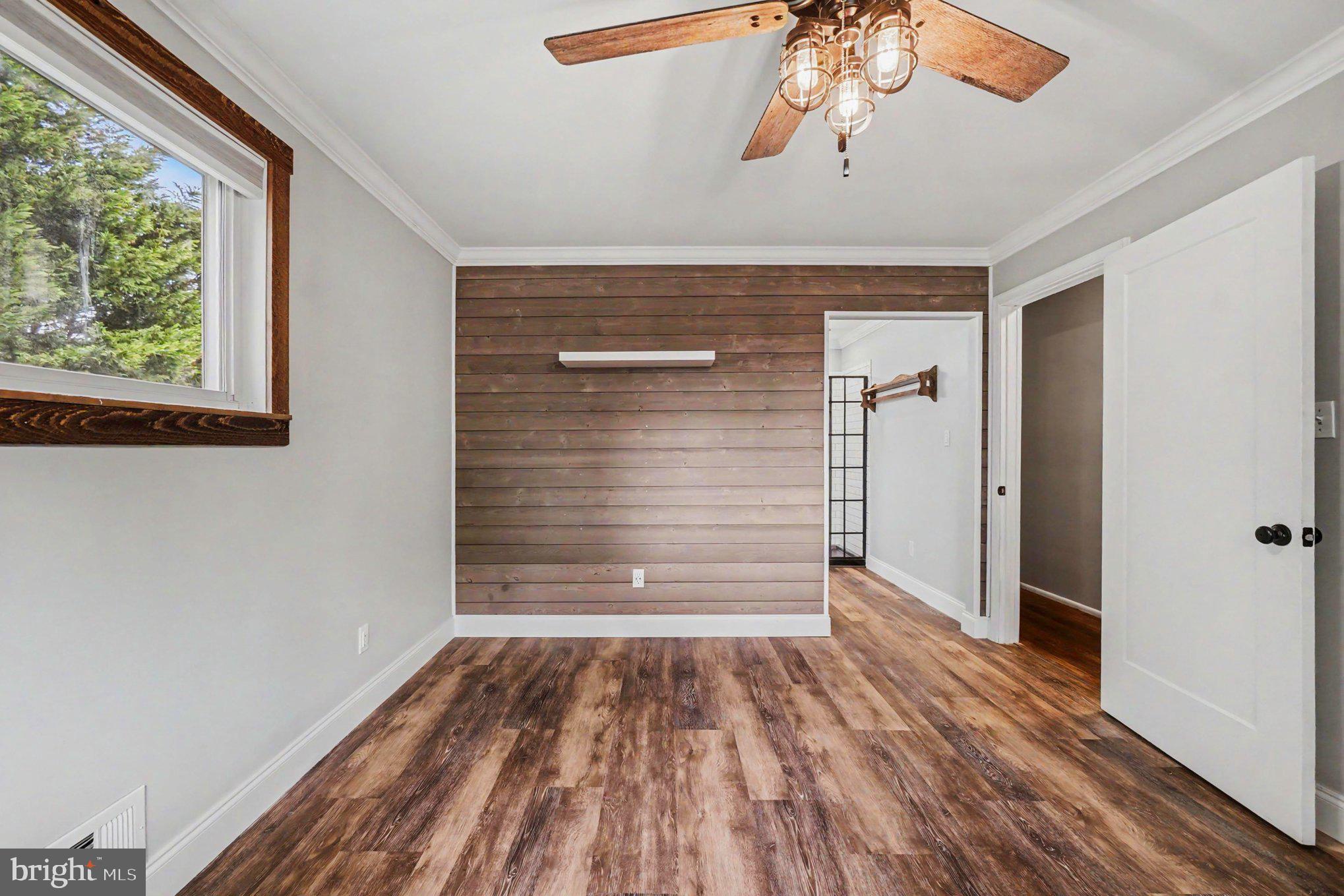 201 Mountain Road Fallston, MD 21047 - Photo 16 of 35 a view of empty room with wooden floor and fan