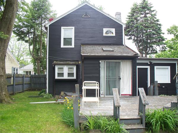 183 Denver Street Springfield, MA 01109 - Photo 2 of 4 a front view of a house with garden