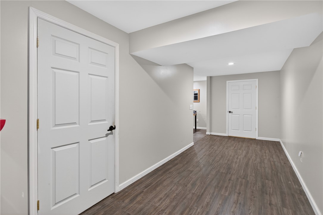 136 Loran Pointe Circle Seneca, SC 29672 - Photo 25 of 50 A refined hall featuring rich hardwood-style flooring, white paneled doors, and subtle recessed lighting.