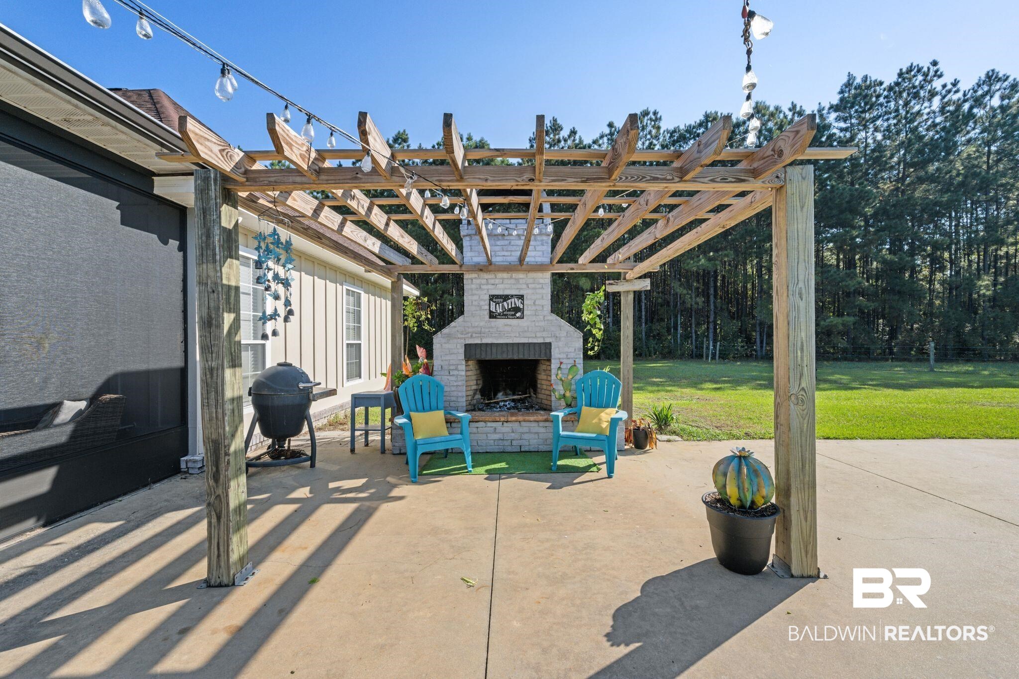 15635 North A N Brady Road Bay Minette, AL 36507 - Photo 37 of 51 View of patio / terrace featuring an outdoor brick fireplace, area for grilling, and a pergola