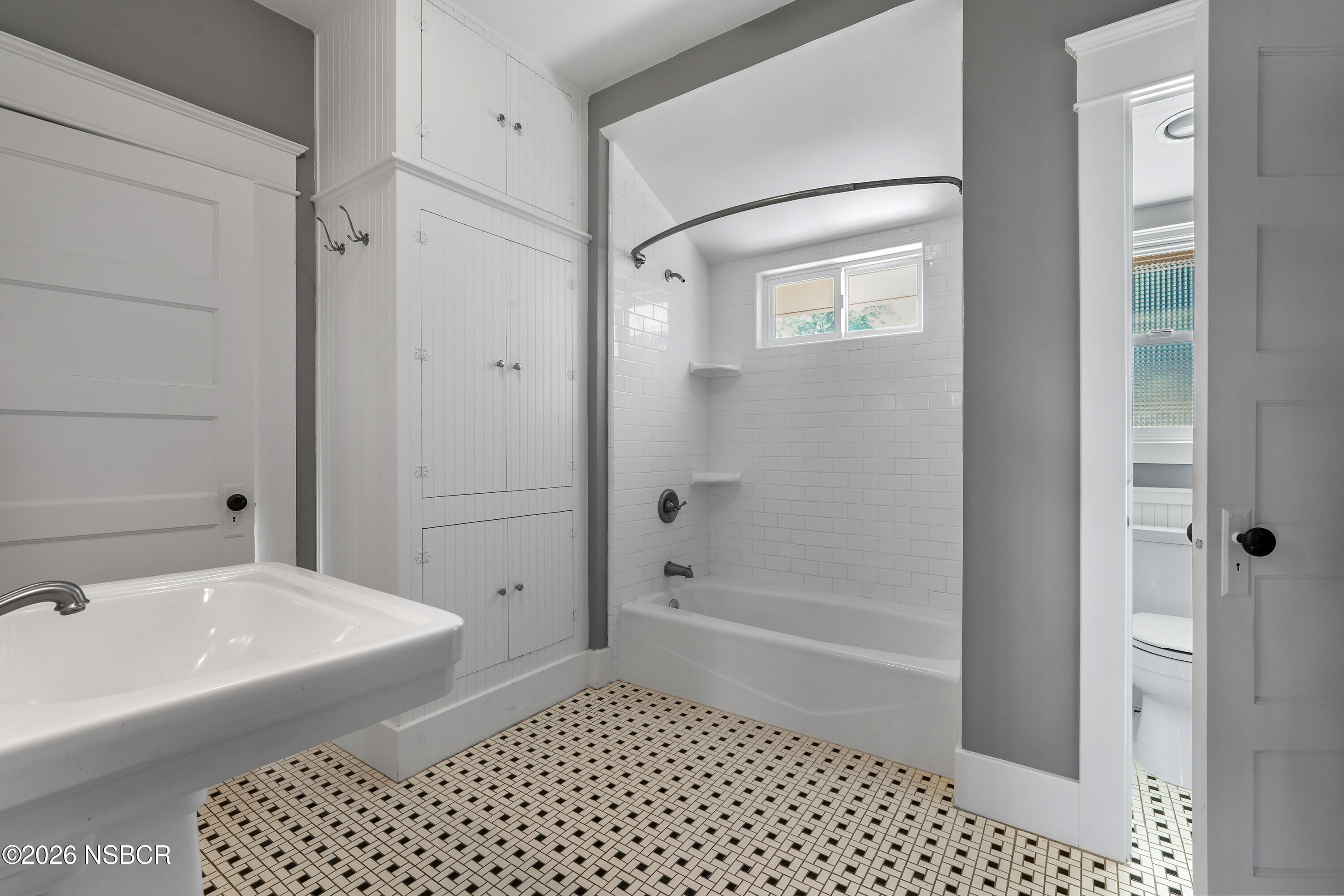 533 Pine Street Solvang, CA 93463 - Photo 17 of 37 a bathroom with a bathtub a shower a toilet and a sink