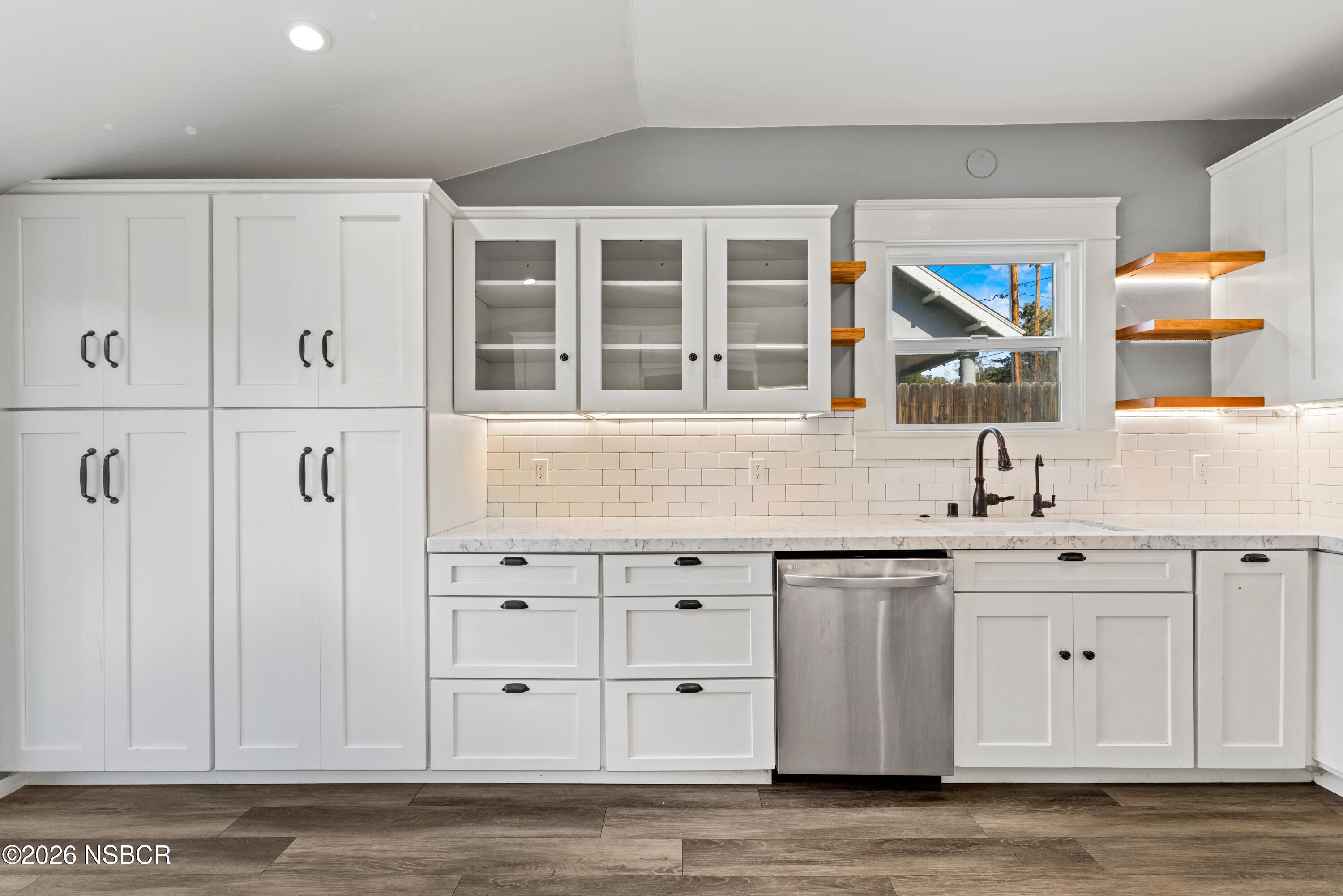 533 Pine Street Solvang, CA 93463 - Photo 19 of 37 a kitchen with stainless steel appliances granite countertop a sink and cabinets
