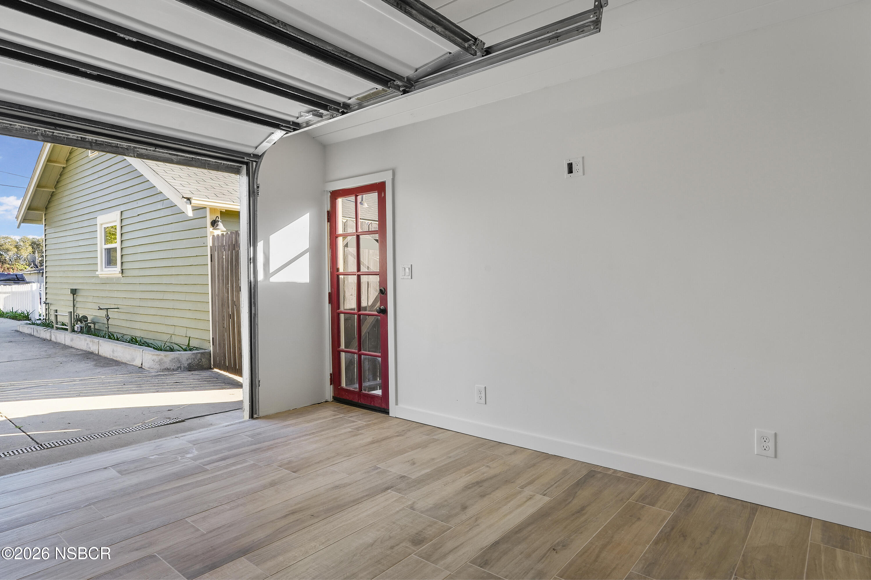 533 Pine Street Solvang, CA 93463 - Photo 25 of 37 an empty room with wooden floor and windows