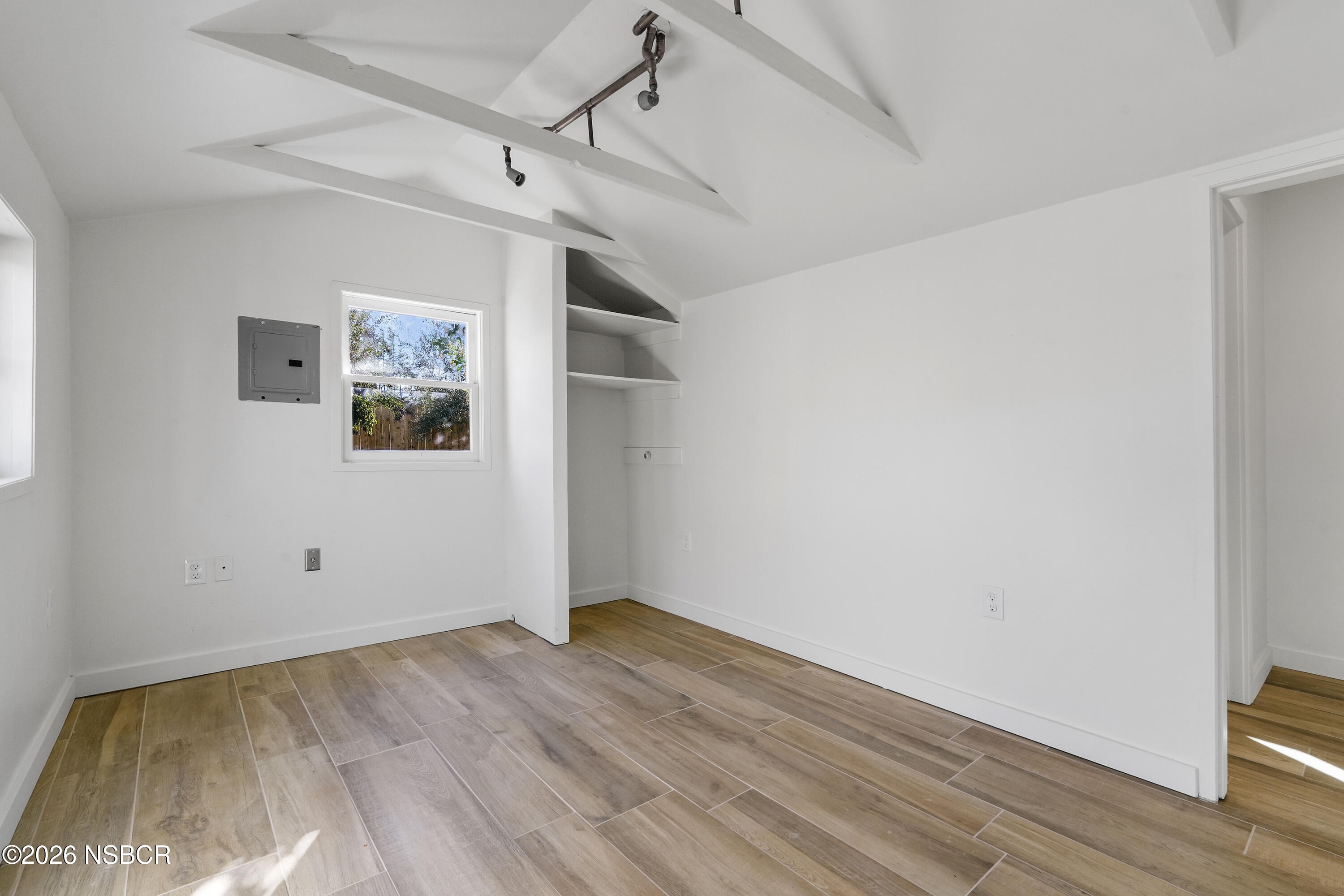 533 Pine Street Solvang, CA 93463 - Photo 26 of 37 an empty room with wooden floor and ceiling fan