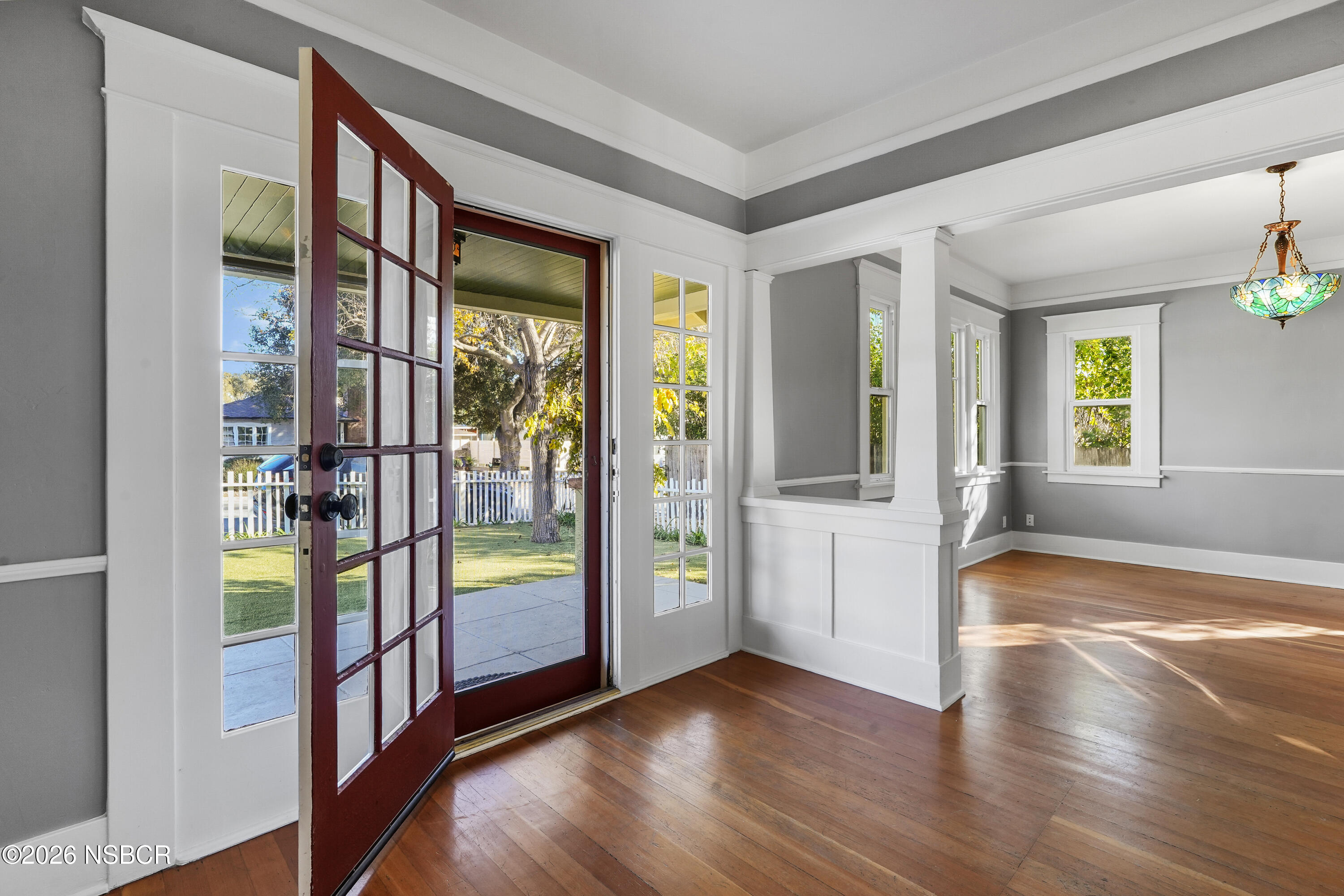 533 Pine Street Solvang, CA 93463 - Photo 3 of 37 a view of an entryway with wooden floor and a bedroom
