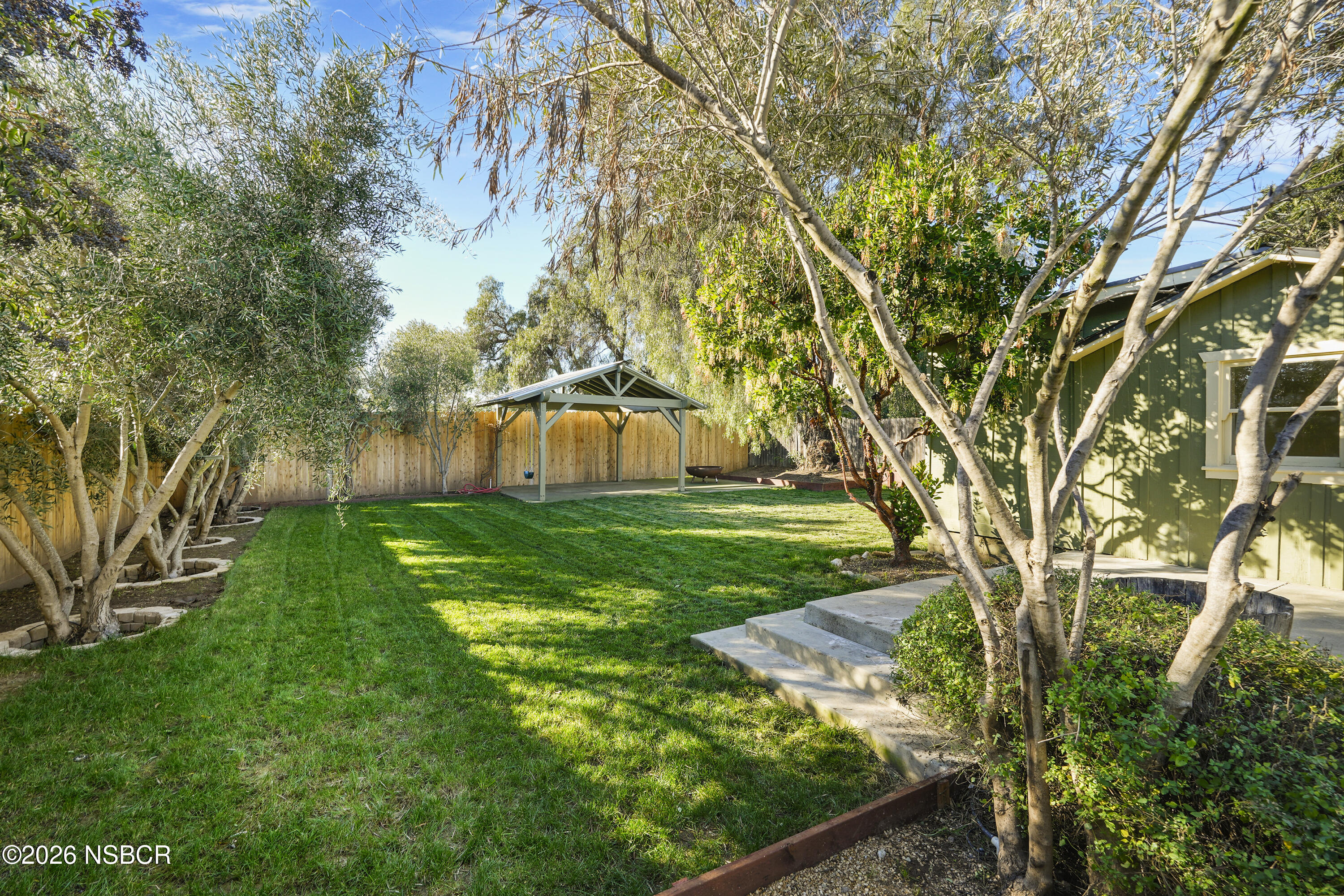 533 Pine Street Solvang, CA 93463 - Photo 31 of 37 a view of a garden with large trees