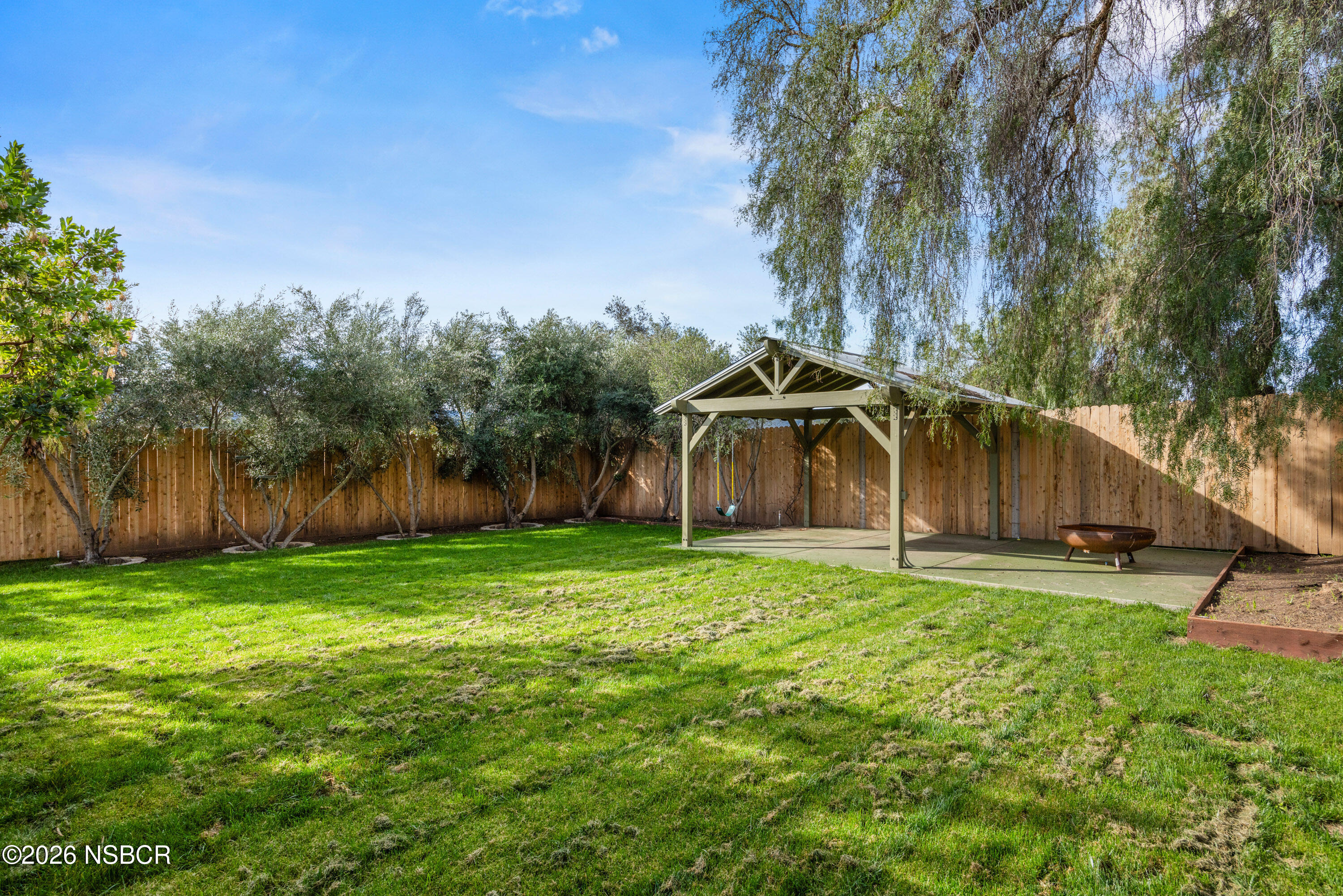 533 Pine Street Solvang, CA 93463 - Photo 32 of 37 a backyard of a house with lots of green space