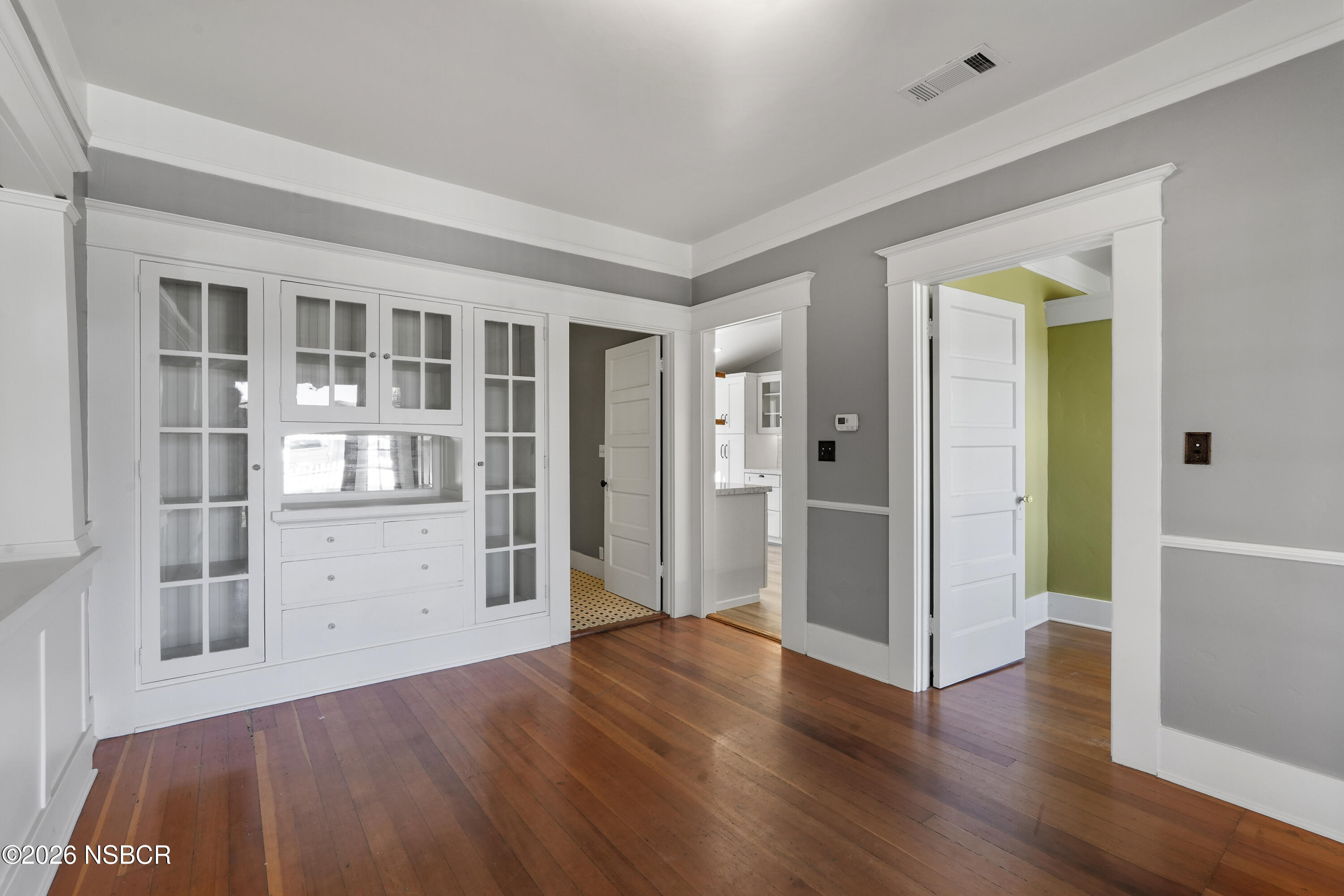 533 Pine Street Solvang, CA 93463 - Photo 4 of 37 a view of empty room with wooden floor and cabinet
