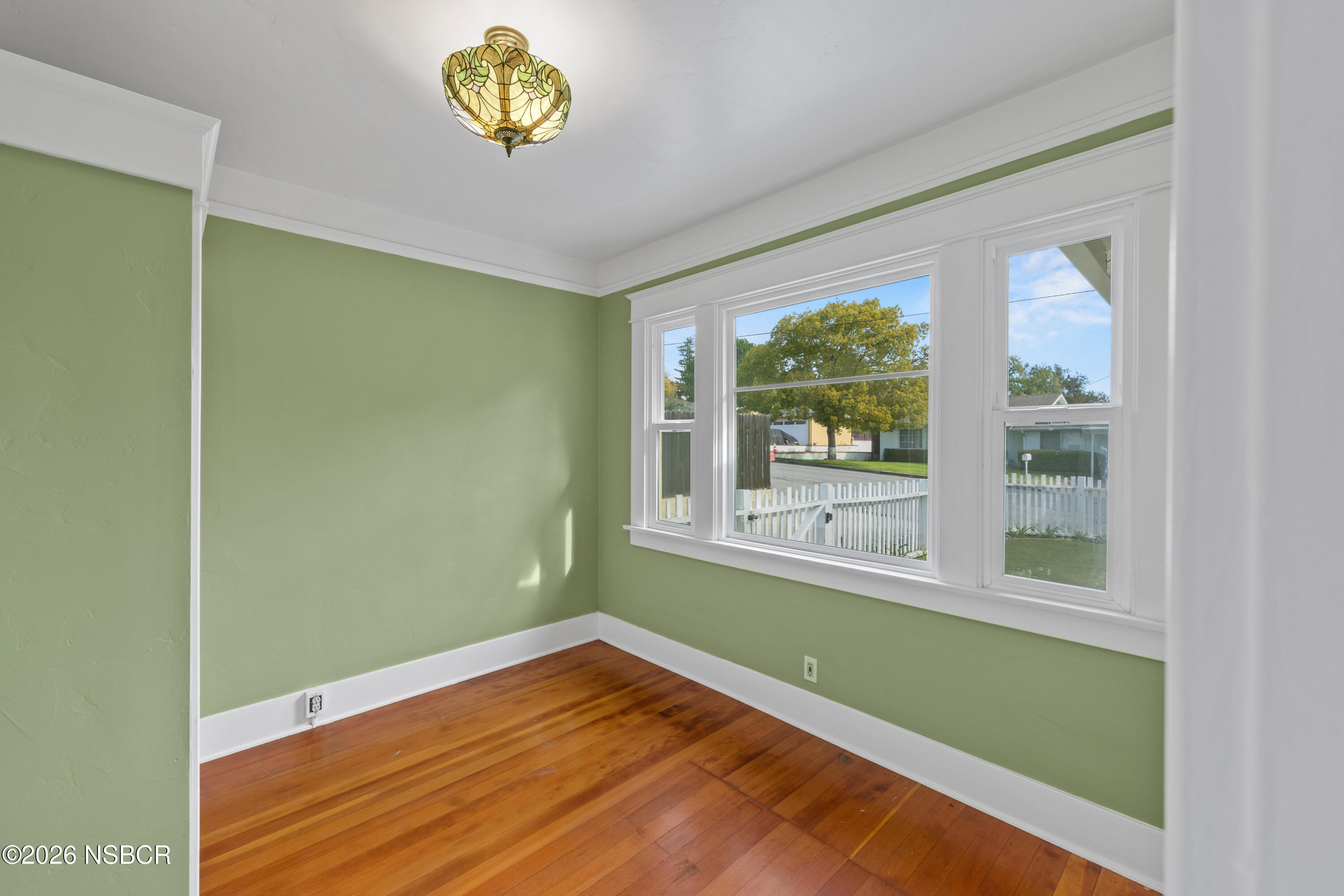 533 Pine Street Solvang, CA 93463 - Photo 6 of 37 a view of an empty room with wooden floor and a window