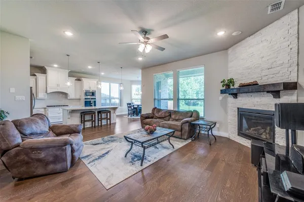 a living room with furniture and a fireplace