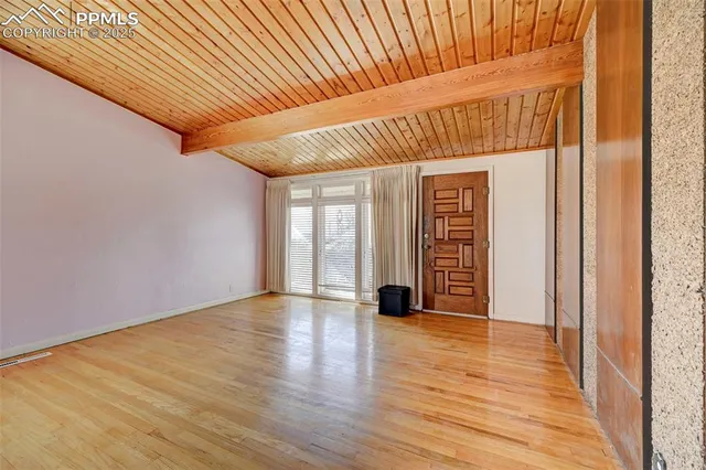 a view of outdoor space with wooden floor