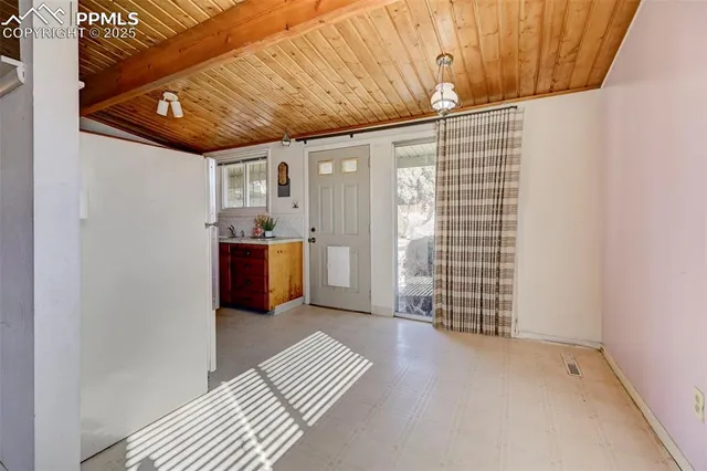 a view of a porch with wooden floor and a shower
