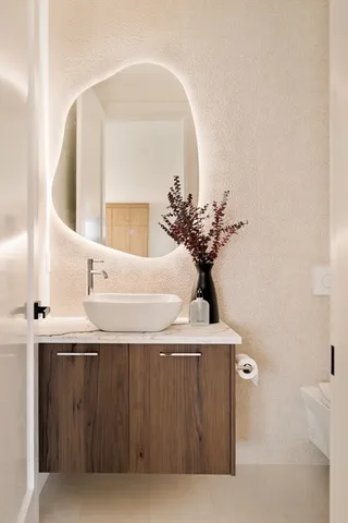a bathroom with a sink and a mirror