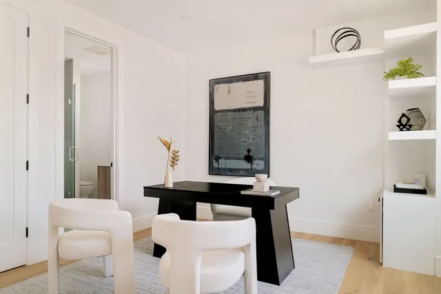 a dining room with table and chairs