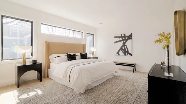 a bedroom with a bed and a table