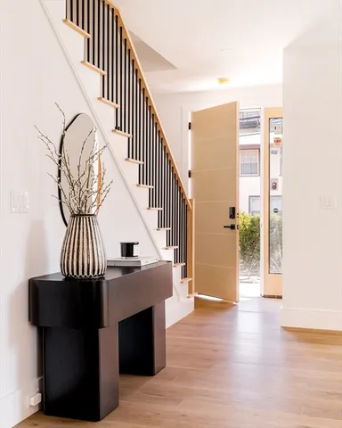 a view of a livingroom with furniture and staircase