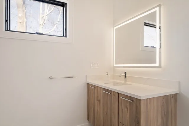 a bathroom with a sink and a mirror