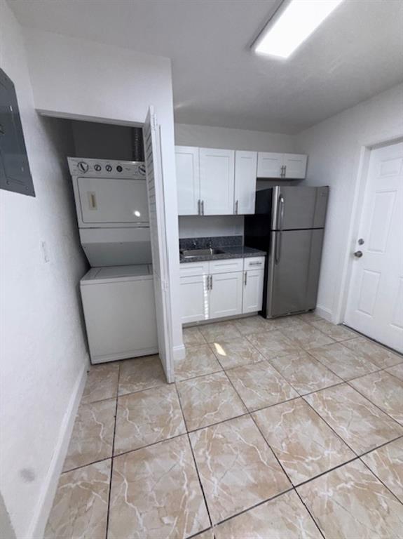 323 Northwest 4th Avenue, Unit R Hallandale Beach, FL 33009 - Photo 5 of 16 a kitchen with a cabinets and steel appliances