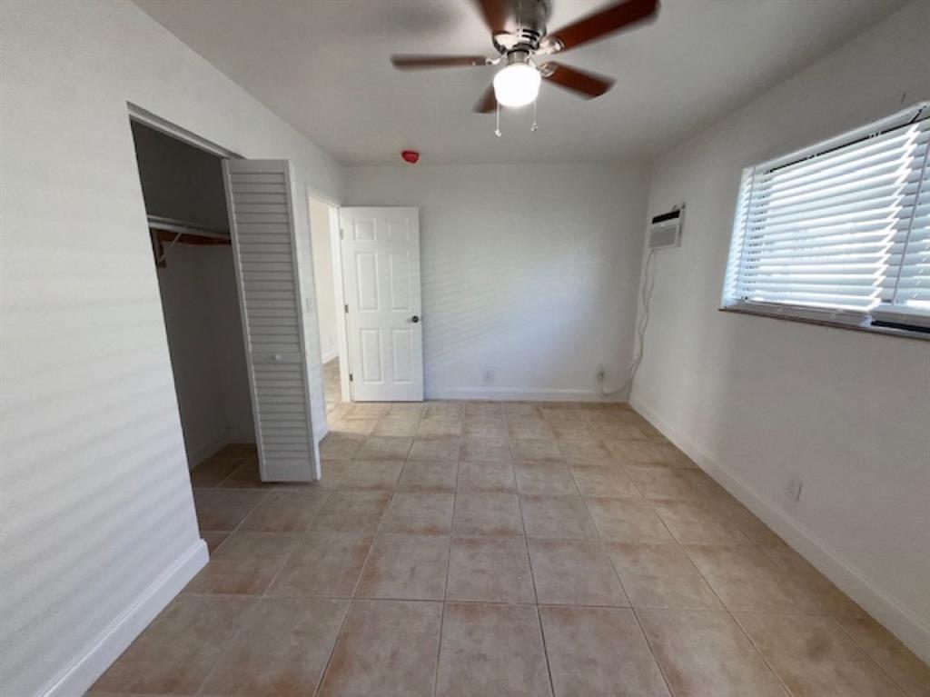 323 Northwest 4th Avenue, Unit R Hallandale Beach, FL 33009 - Photo 10 of 16 a view of an empty room with a window