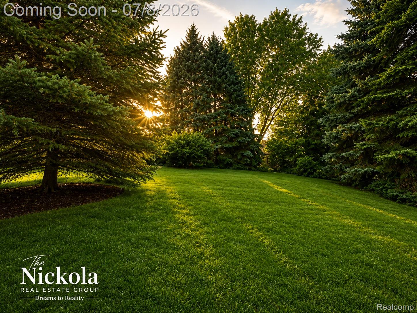 414 Whitney Drive Rochester, MI 48307 - Photo 4 of 30 Expansive green lawn surrounded by mature evergreen and deciduous trees