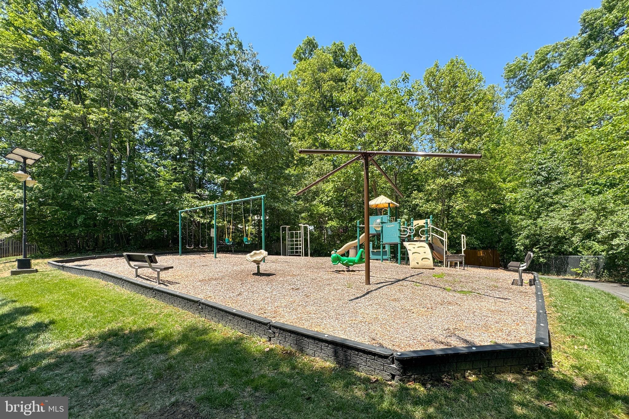 18475 Kerill Road Triangle, VA 22172 - Photo 93 of 99 a view of a swimming pool with a patio