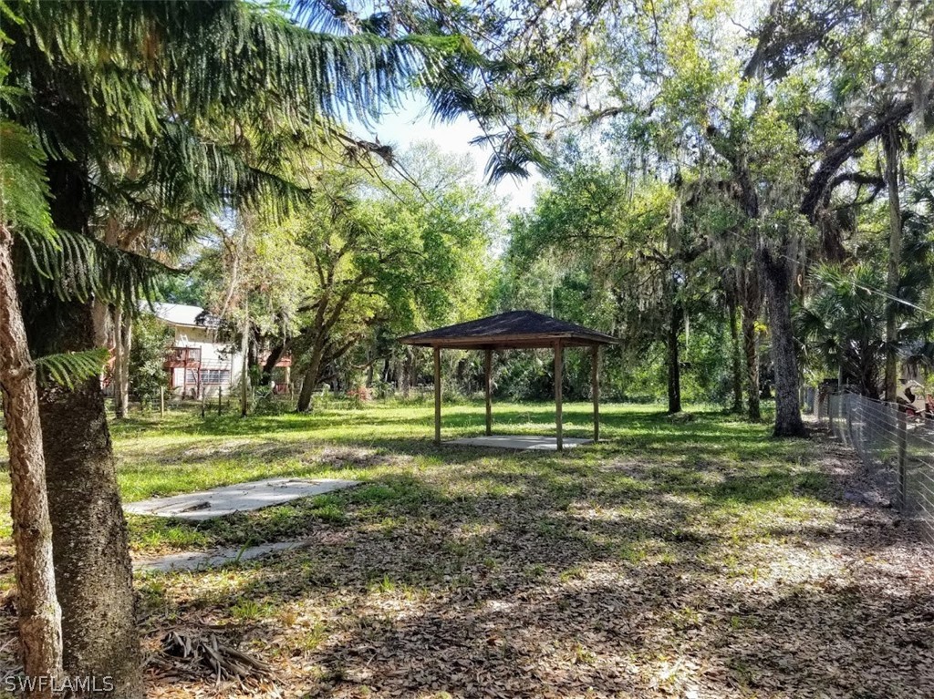 1343 Ortona Locks Road Moore Haven, FL 33471 - Photo 3 of 7 a view of a park with large trees