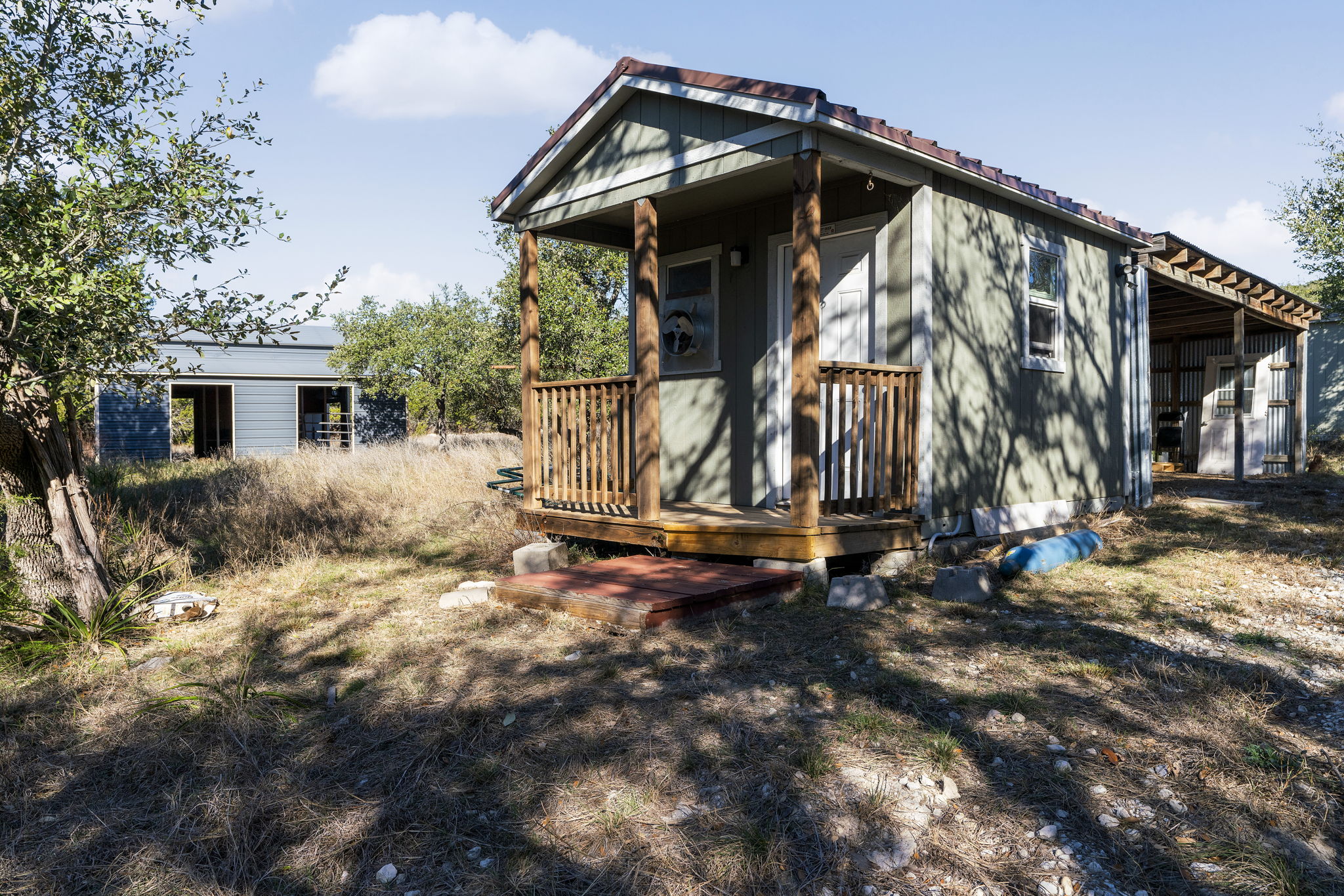 2058 Montell Road Wimberley, TX 78676 - Photo 27 of 35 a view of a house with backyard and trees