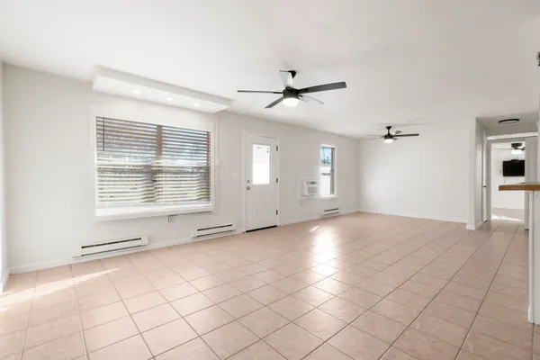 a view of an empty room with a window