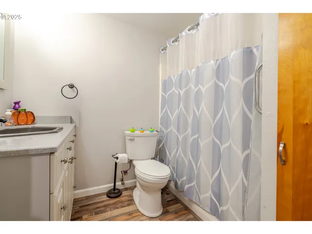 a bathroom with a toilet and a sink