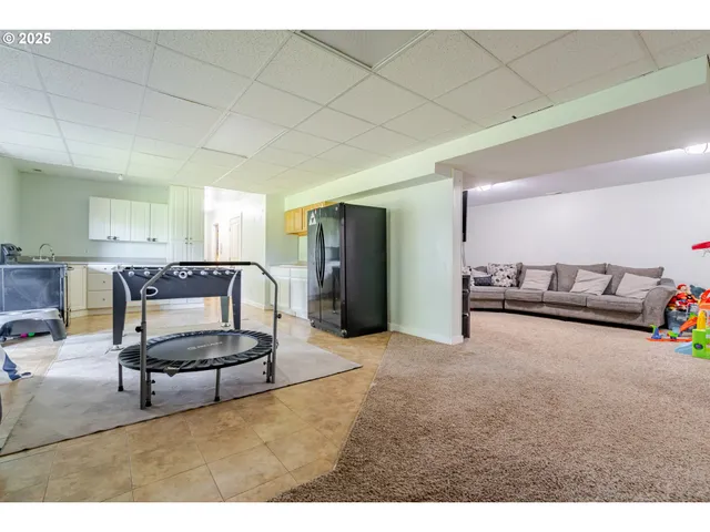 a living room with furniture and kitchen view