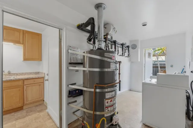 a kitchen with cabinets and stainless steel appliances