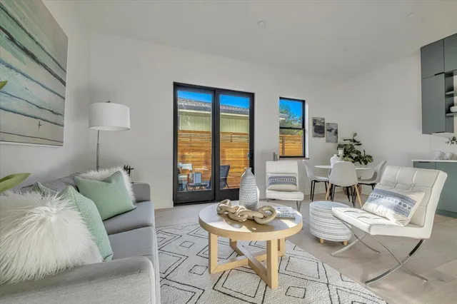 a living room with furniture and a table