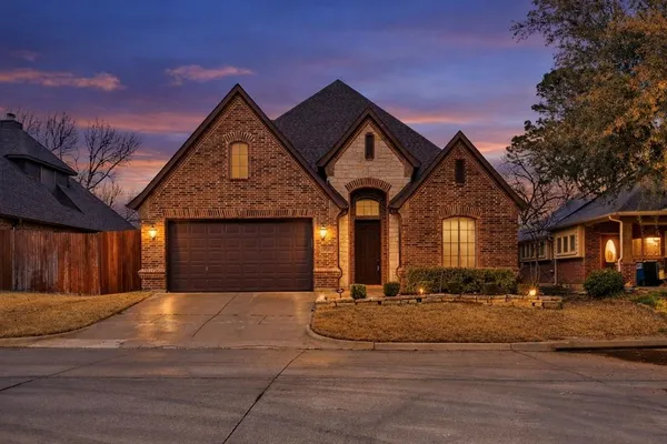 a front view of a house with yard