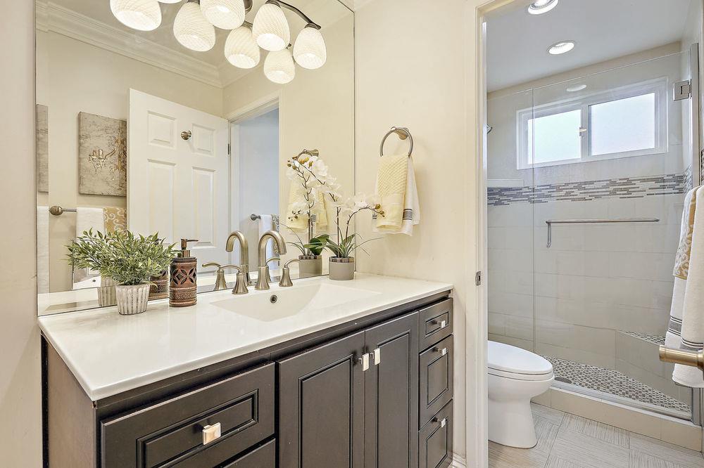 222 Thomas Drive Los Gatos, CA 95032 - Photo 11 of 28 a bathroom with a sink a toilet and a mirror