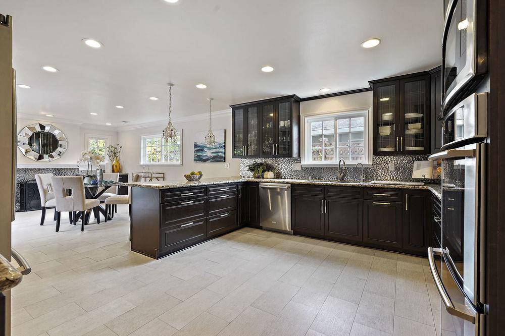 222 Thomas Drive Los Gatos, CA 95032 - Photo 21 of 28 a kitchen with a sink stove and cabinets