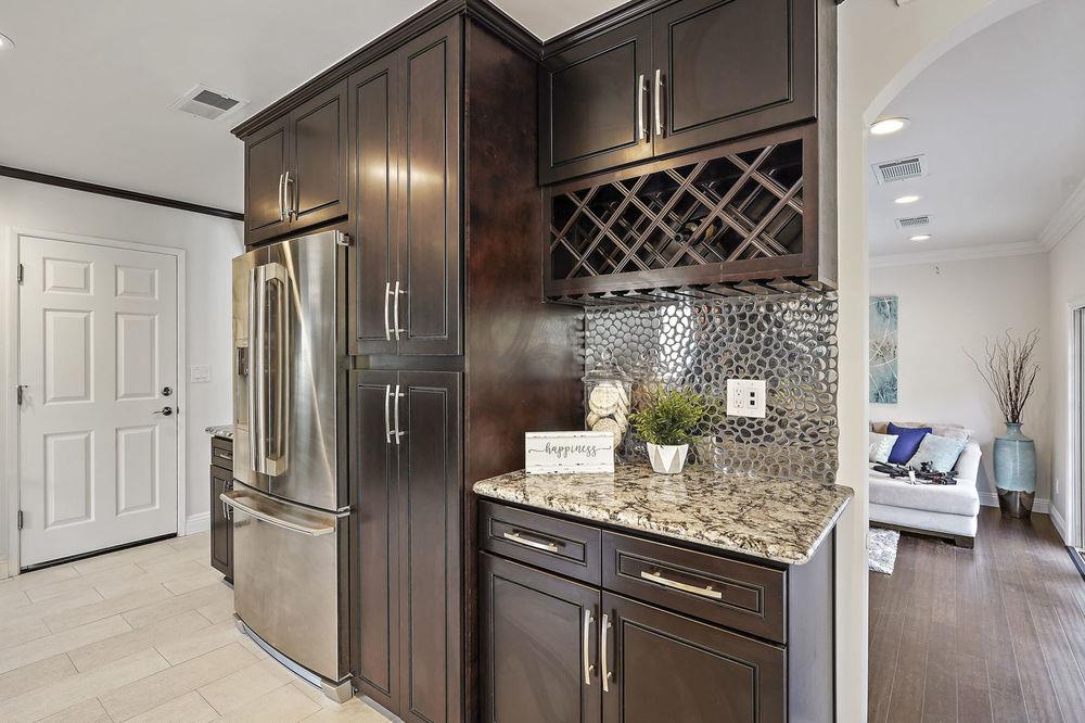 222 Thomas Drive Los Gatos, CA 95032 - Photo 22 of 28 a kitchen with granite countertop stainless steel appliances a refrigerator and a sink