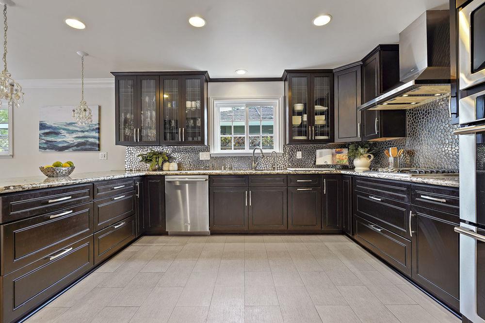 222 Thomas Drive Los Gatos, CA 95032 - Photo 23 of 28 a kitchen with stainless steel appliances granite countertop a stove and cabinets