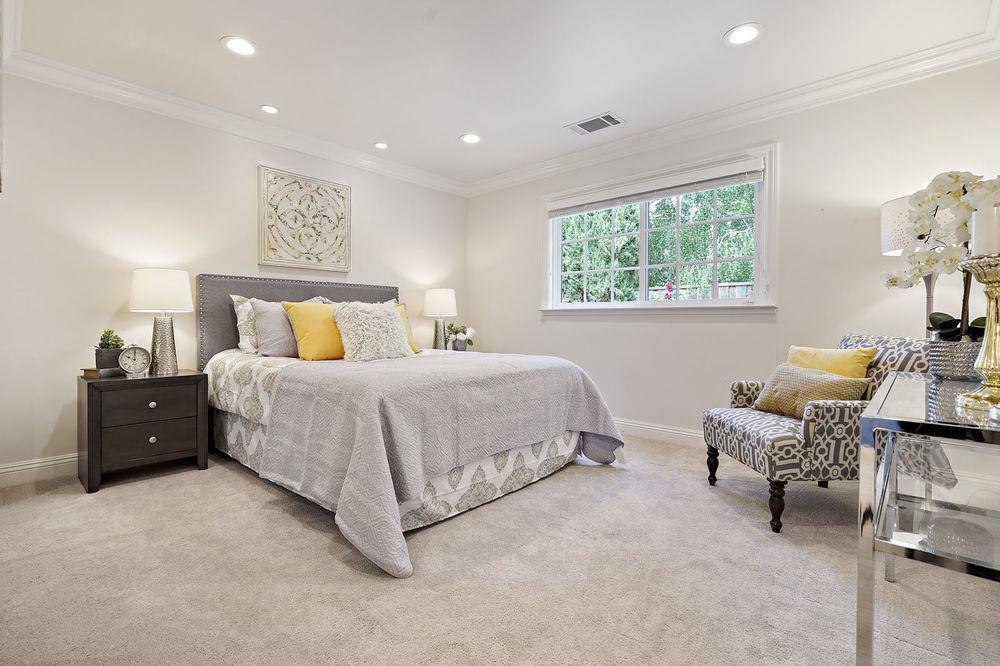 222 Thomas Drive Los Gatos, CA 95032 - Photo 27 of 28 a spacious bedroom with a bed and a window